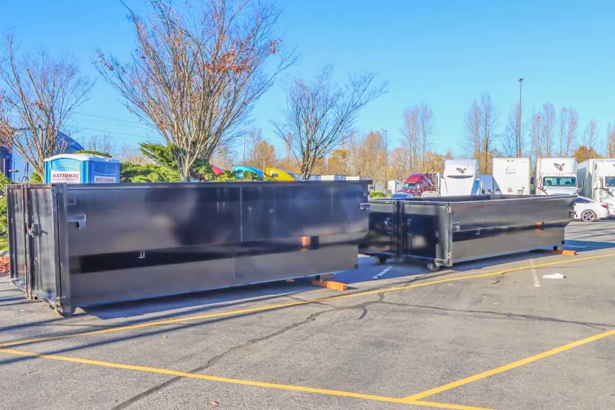 Professional dumpster rental service with roll-off container on residential driveway in Balm